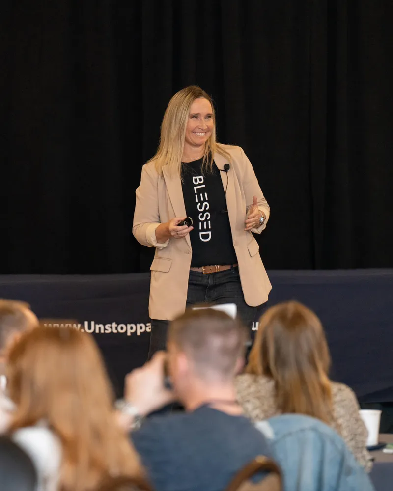 Natty Lewis speaking on stage